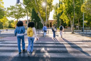 multiracial-students-crossing-street-on-university